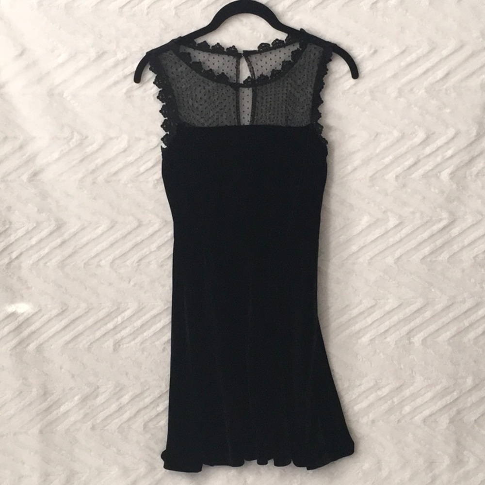Velvet feeling dress with lace neckline and a button closure. Size XS